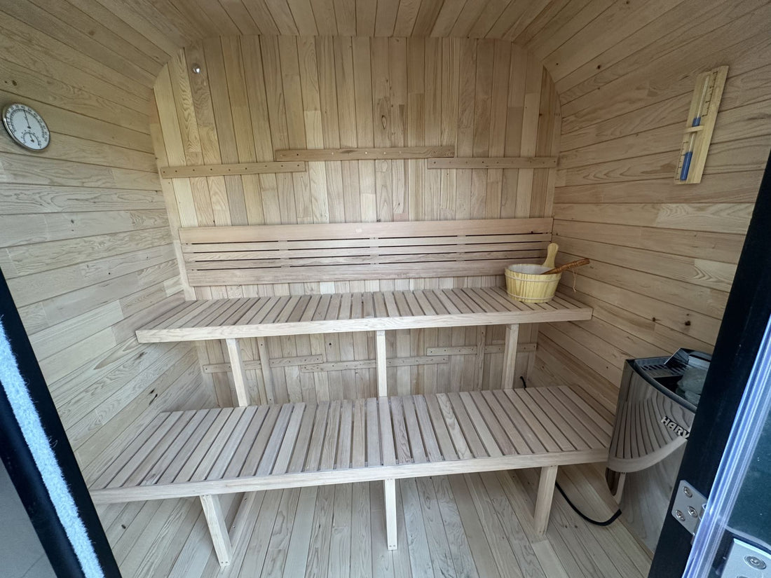 Two-tier Canadian hemlock benches inside a sauna